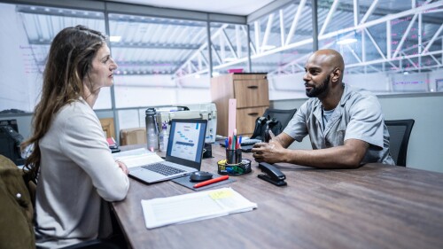 Manager talking to employee in the office