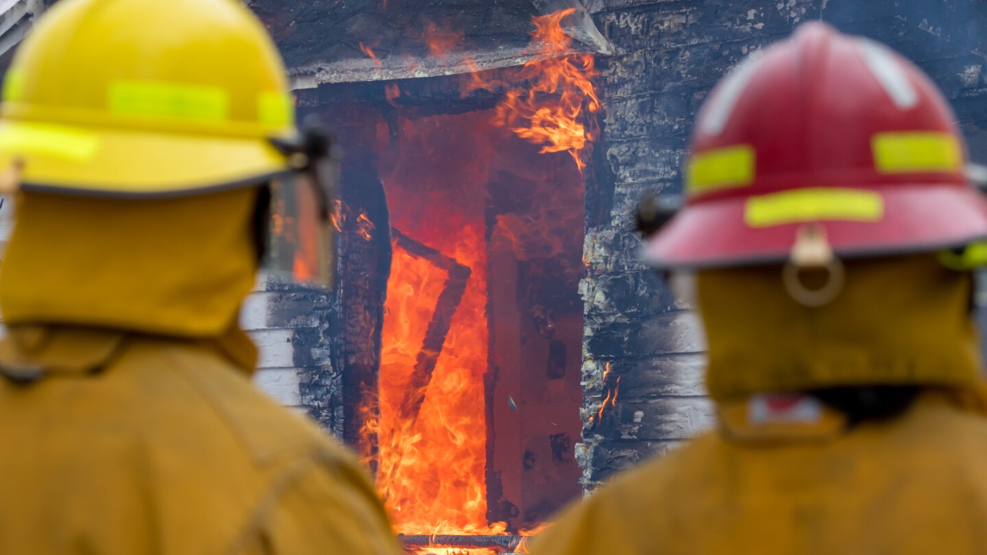 Two Firefighters watching a Fire