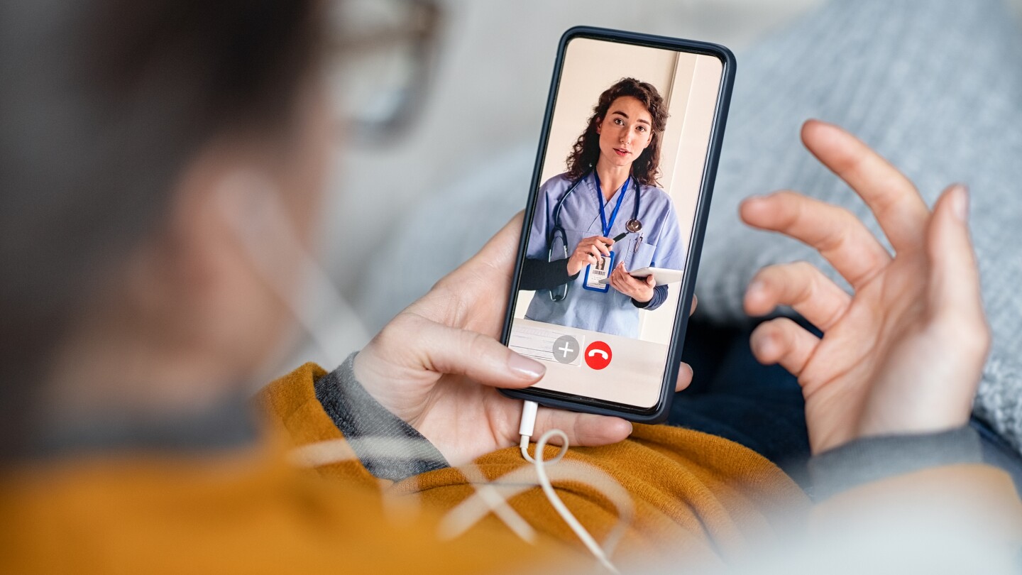 Woman doing video call with doctor