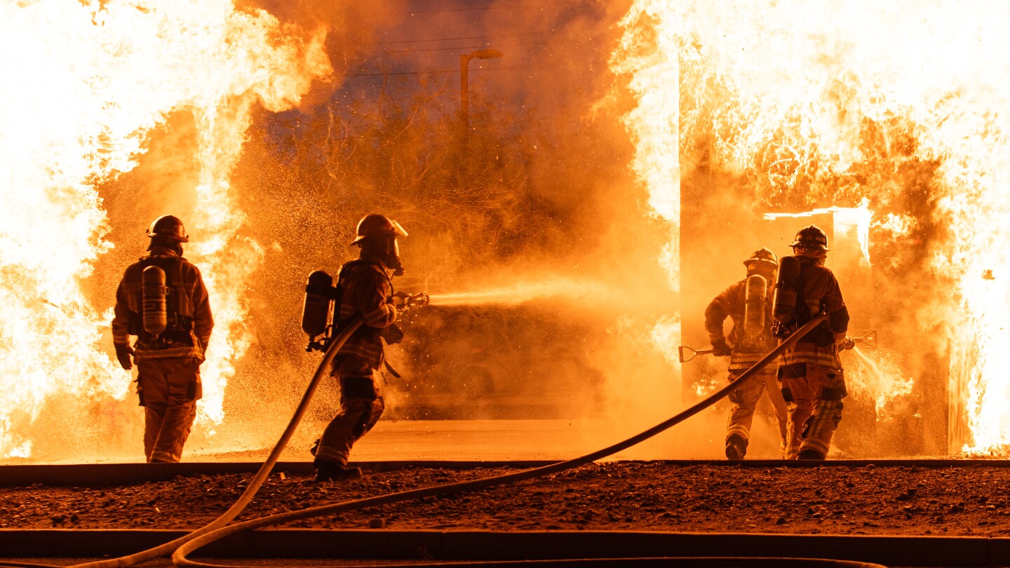 Firefighters Battling a Roaring Fire